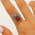 Gothic black alloy spider ring featuring a vibrant red teardrop gemstone on hand - Red Zirconia Style (2051) / Gunmetal