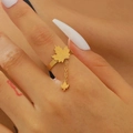 Detail of 18k gold maple leaf ring with elegant chain tassel shown on model hand - Gold Maple Leaf Open Ring (0568)