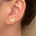 Golden butterfly ear clip with white zircon stones for non-pierced ears on a model - Single Butterfly Ear Cuff (06 14K Imitation Gold 6121)