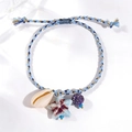 Adjustable woven bracelet with blue ceramic starfish and natural seashell pendant - Dark Blue