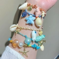 Summer ocean-themed bracelet set with hand-painted ceramic starfish and colorful shells - Multilayer Layering Bracelet