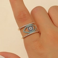 Close-up of a tiered gold Evil Eye ring with blue turquoise and sparkling white zircon - Multi-loop Evil Eye Style (10198) / KC Gold