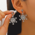 Silver snowflake earrings with glittering crystals and small white pearls on model ear - 04 White K Style (A-476)