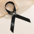 Elegant black satin bow mourning pin with gold-trimmed enamel center on a stone plate - Black Satin Gold-Trimmed Bow (15 Black)