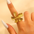 Macro shot of a 18k gold-plated open ring featuring a five-petal floral design with texture - Five-Petal Flower / Gold (S278)