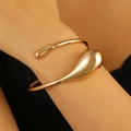Modern minimalist gold-finish teardrop open bangle with high-polish metallic surface - Asymmetric Organic Bangle (H-59) / KC Gold