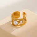 Detail of a vintage golden open ring with dual pearl inlay on a stone texture background - Artificial Pearl Ring (3006)