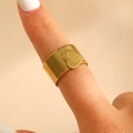 Detailed view of a wide gold-plated stainless steel ring with a heart charm dangle - Solid Heart Style (G-453)