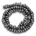 Macro view of irregular faceted hematite beads with a polished metallic grey finish - Approx 5x8mm size, approx 1.2mm hole (approx 90 beads) / Hematite Color