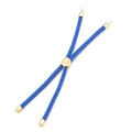Close-up of blue braided rope bracelet with gold-plated tree of life sliding metal connector - Gold Buckle / Blue