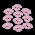 Flat lay of ten cute pink resin puppy charms for DIY phone cases and hair accessories - 12x15mm / Pink Bow Puppy