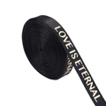Detail of black rib ribbon with gold Love Is Eternal text for DIY gift wrapping - 1cm Wide / Black