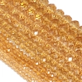 Macro view of amber faceted crystal rondelle beads for DIY jewelry making and crafts - Light Burgundy Champagne