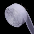 Macro detail of white organza ribbon with golden edges for DIY gift wrapping and hair bows - White Silver