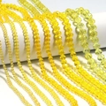 Macro view of yellow faceted crystal abacus beads for DIY handmade jewelry crafting - Yellow