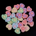 Flat lay of colorful resin heart charms for DIY crafts in macaron candy colors - Random Mixed Colors