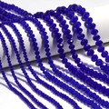 Detailed view of faceted dark blue crystal beads arranged by size for DIY jewelry making - Dark Blue