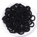 Macro view of seamless black high-elasticity cotton hair ties with textured towel knit finish - 2cm Diameter / Black