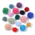 Flat lay of colorful fluffy faux teddy wool pom-poms for DIY crafts and accessories - 1.5cm Diameter / Random Mixed Colors