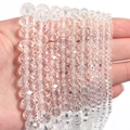 Macro view of transparent faceted crystal beads in various sizes for DIY jewelry - White