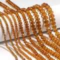 Macro detail of faceted amber glass beads for DIY jewelry with sparkling crystal texture - 3x2mm (Approx. 108 Pcs) / Medium Coffee