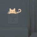 Adesivo da parete a forma di gatto luminoso per interruttore con effetto fluorescente - Rosa