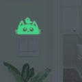 Leuchtender Wandaufkleber für Lichtschalter mit Katze und Vogel Motiv im Dunkeln leuchtend - Grün