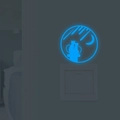 Luminous wall sticker featuring cats and moon in sky blue glow over a white power switch - Blue