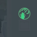 Luminous wall sticker featuring cats, moon and stars glowing in the dark near switch - Green