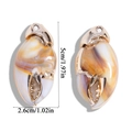 Detailed view of crab claw pendants with marble resin texture and gold metal frame - 50x26mm (11.21g)