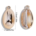Detailed view showing both sides of a gold shell pendant with dimensions 3.2cm by 1.7cm - 32x17mm (3.8g)