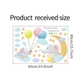 Flat lay of cartoon elephant wall decals with clouds and stars in 60x40cm sheet size - Cartoon Elephant Balloon Style / Medium