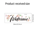 Detail der selbstklebenden Welcome Wandtattoo Maße 39cm x 14cm mit floralen Akzenten - 14*39cm