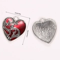 Macro view of vintage heart charm showing red enamel front and brushed silver back - Scroll Embossed Sacred Heart (A5-157)