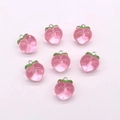 Detailed close-up of seven pink resin peach charms with green leaves and metal rings - 17*20mm / Transparent Pink (A5-211)