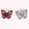 Macro view of gothic butterfly pendants with red enamel finish and skull detailing - Skull Butterfly Style (A5-194)