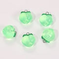 Close-up of translucent green resin peach pendants with glitter and silver metal rings - Transparent Green