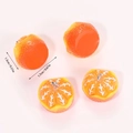 Detail showing resin orange slice pendant with realistic texture and 1.3cm x 1.7cm dimensions - Peeled Orange (A5-199)