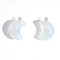 Detail shot of translucent opal white acrylic crescent moon pendants for DIY jewelry - White
