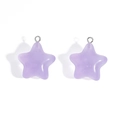Close-up of lavender purple star charms with smooth resin finish for DIY jewelry crafting - Purple