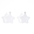 Macro detail of white star acrylic charms with silver metal rings for DIY jewelry - White