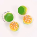 Macro shot of resin orange charms with silver loops and detailed fruit pulp texture - Peeled Green Orange (A5-199)