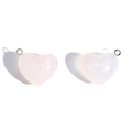 Macro detail of translucent pink heart-shaped pendants with silver metal rings for DIY jewelry - White