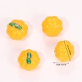 Detail of four yellow resin pumpkin charms with dimensions 1.7cm for DIY jewelry making - Yellow Pumpkin (A5-209)