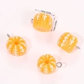 Macro shot of 4 resin pumpkin pendants with white veins and silver loops for DIY - Orange (A5-208)