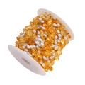 Detail view of irregular yellow natural stone and pearl beaded chain on a white spool - Gold Plated Orange (1m)