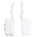 Close-up of a white textured rectangle jewelry tag with gold Fashion Jewelry text and string - Jewelry Series White Tag with Elastic String (A5-439)