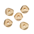 Macro view of five golden triangular spacer beads with smooth metallic finish for DIY jewelry - Kc Gold / 6*6mm / 0.03g / Pore Diameter Approx. 1mm