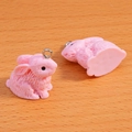 Detailed macro view of pink flocking rabbit pendants with textured fur and metal rings - Plain Style / 21x21mm / Pink