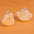 Detailed view of yellow flocked chick pendants with metal rings for DIY jewelry and keychains - Orange